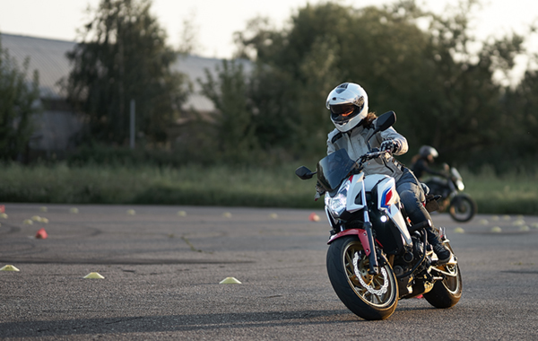 Gymkhana training day. Girl trainings ride motocycle